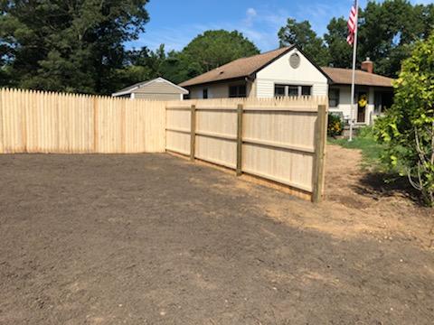 House with Fence — Long Island, NY — Bamboo Removal and Landscaping Design in Long Island by Jose Benitez