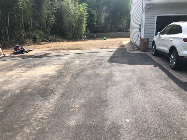 Car in the Garage — Long Island, NY — Bamboo Removal and Landscaping Design in Long Island by Jose Benitez