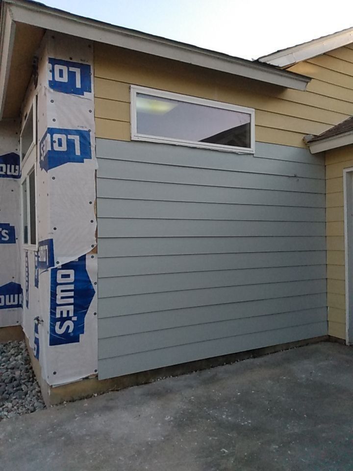 The side of a house with lowes siding on it