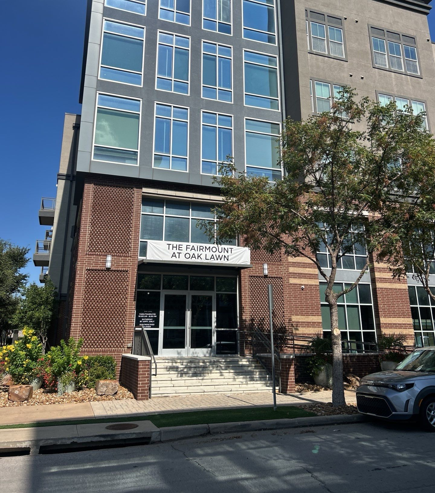 Family gathered at a dining table in a kitchen. They are eating and talking together.