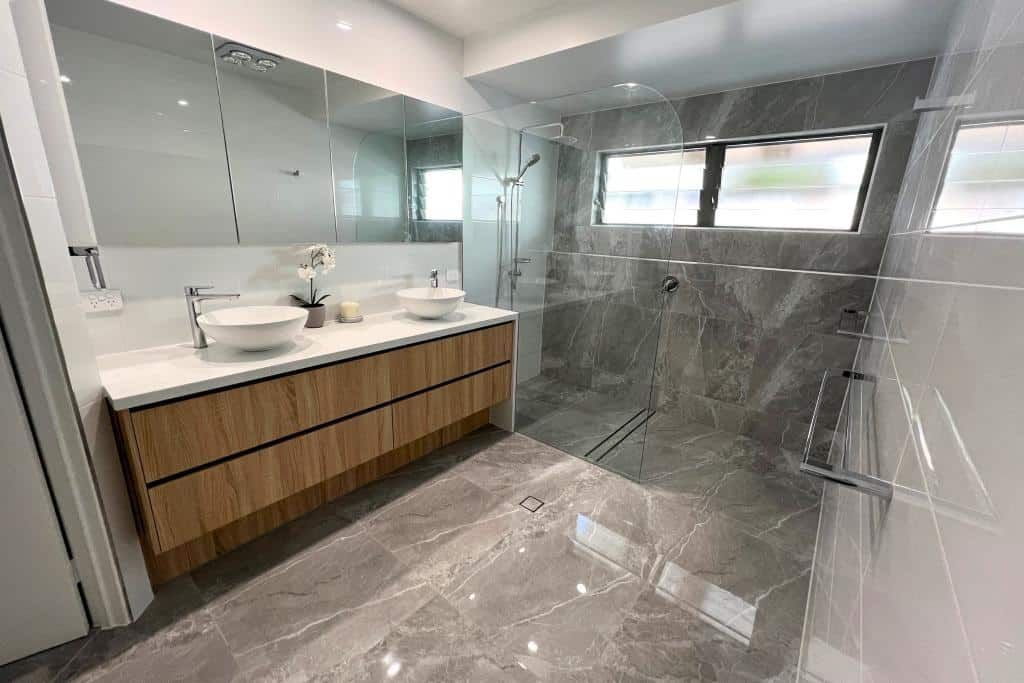 Bathroom With Two Sinks and a Walk in Shower — Nyblad Construction in Caloundra West, QLD