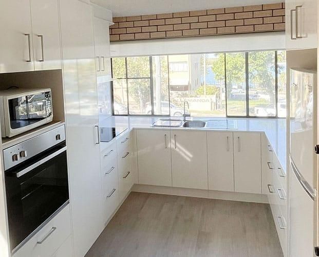 Kitchen With White Cabinets — Nyblad Construction in Caloundra West, QLD