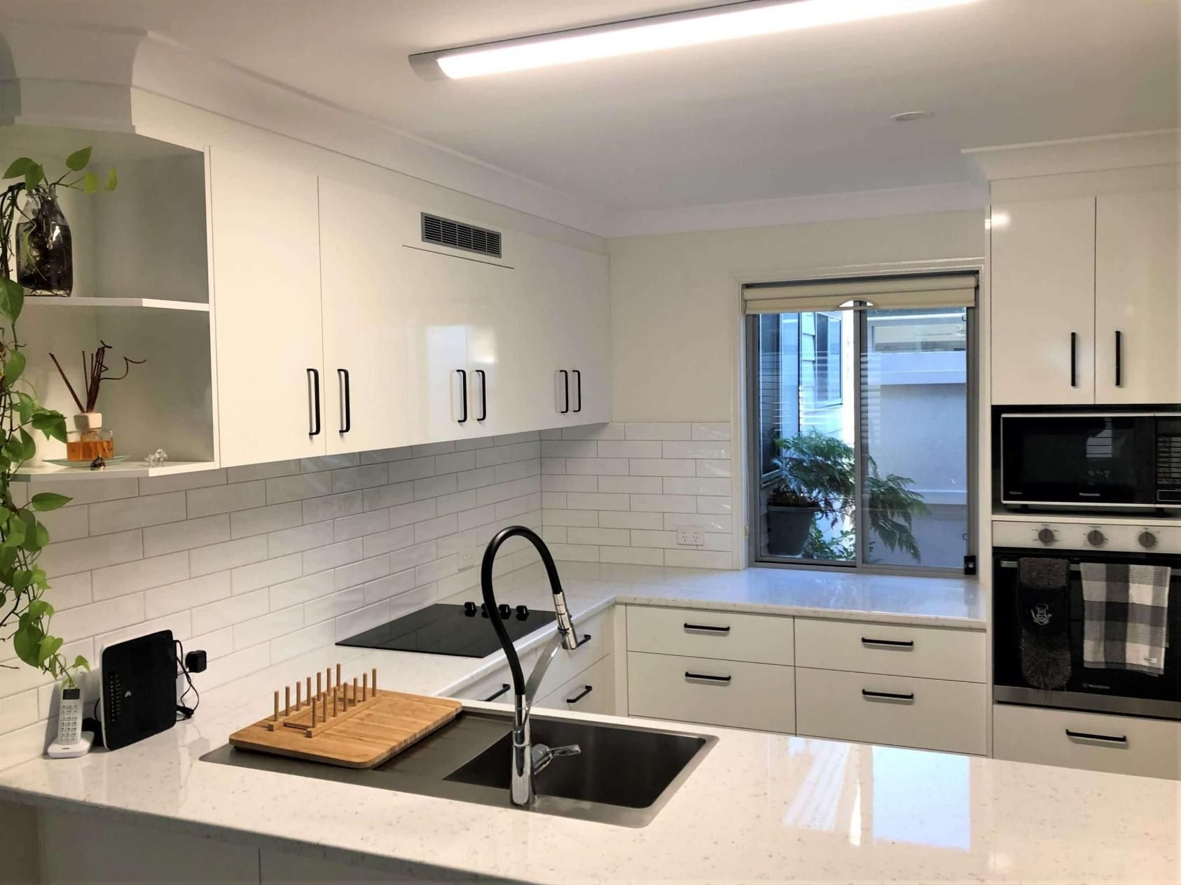 Kitchen With White Cabinets — Nyblad Construction in Caloundra West, QLD
