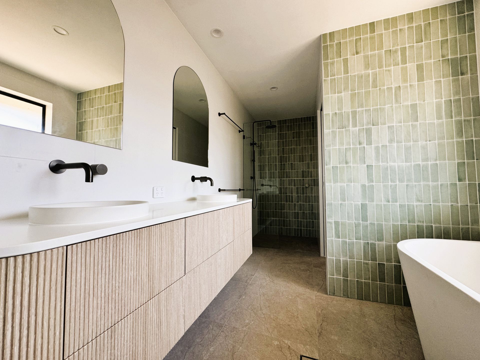 Modern bathroom renovation Sunshine Coast with walk-in shower and floating vanity