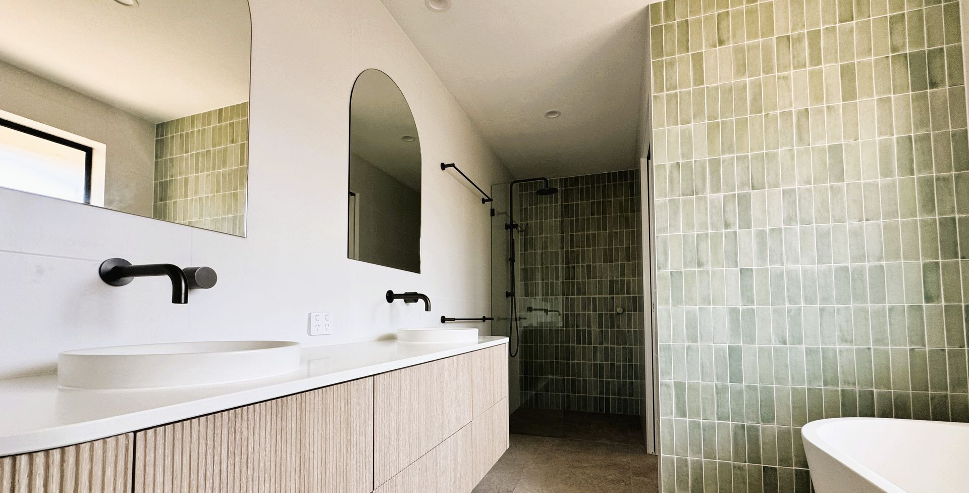 Modern bathroom renovation Sunshine Coast with walk-in shower and floating vanity
