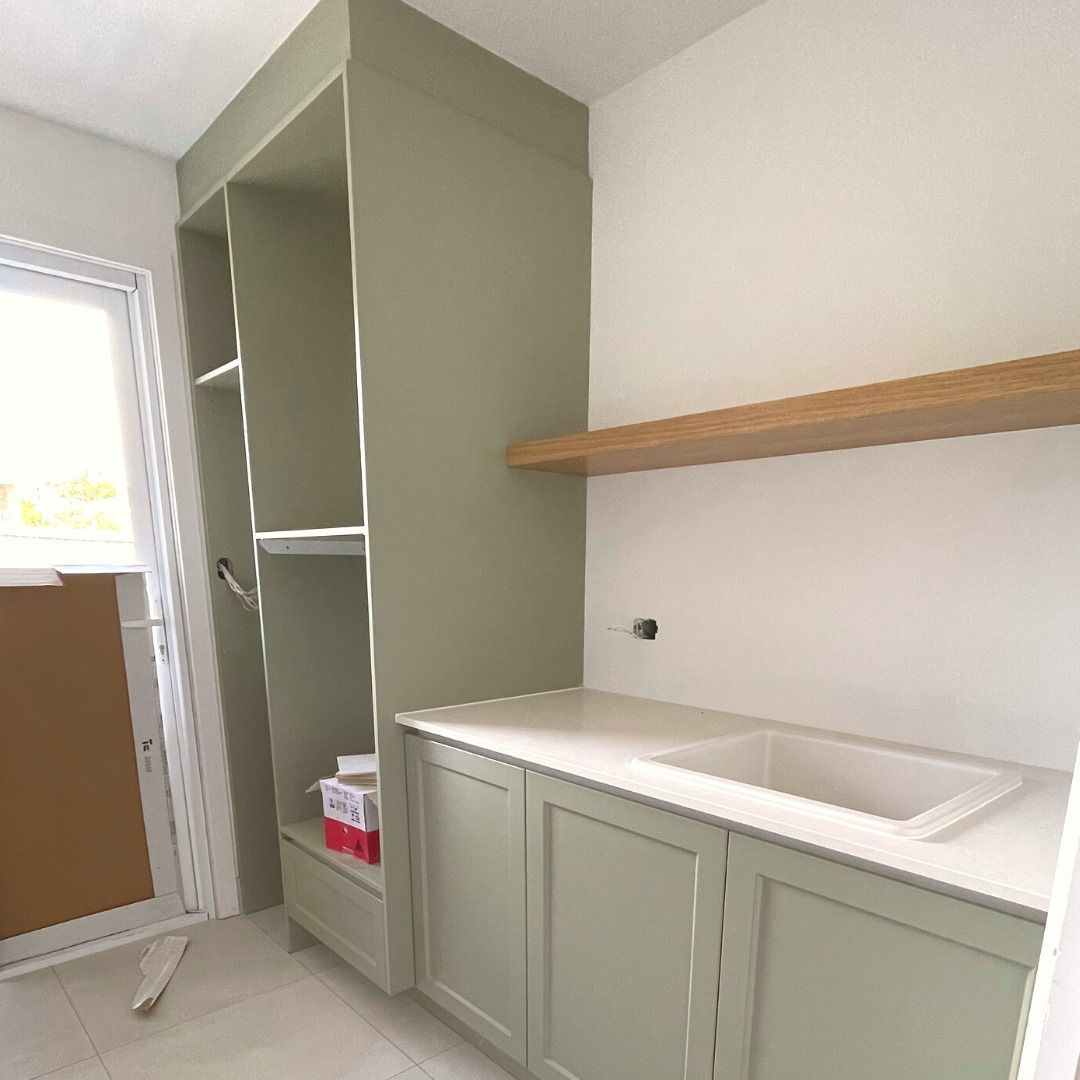 Green Laundry Room With Cabinets, Open Shelving, and a Sink — Nyblad Construction in Buderim, QLD