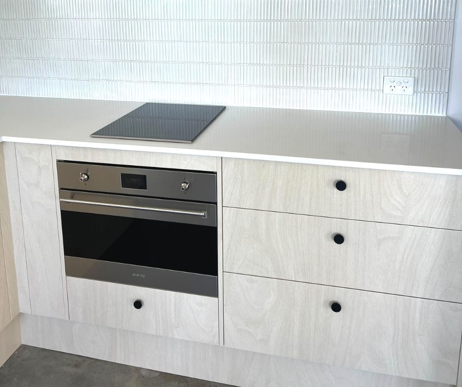 Kitchen Cabinetry With Built-in Oven and Cooktop — Nyblad Construction in Caloundra, QLD