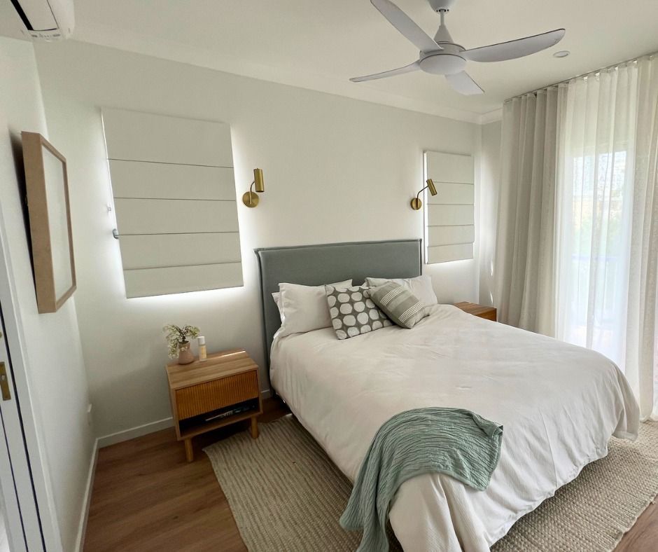 Bedroom With Bed, Nightstands, Windows, and Ceiling Fan — Nyblad Construction in Caloundra, QLD