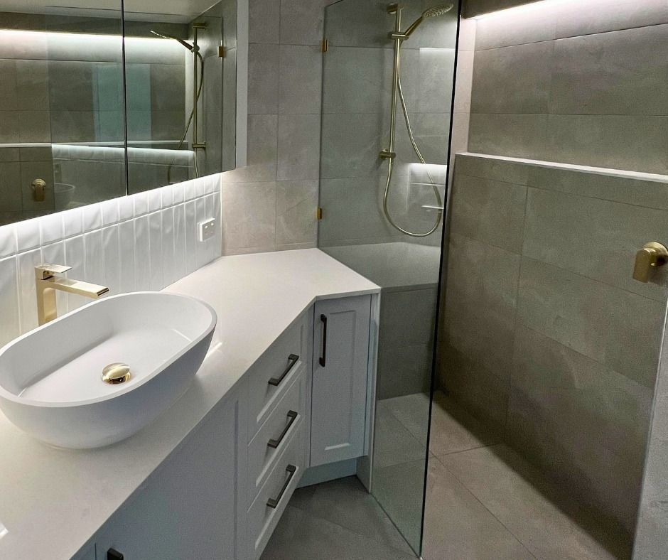 Modern Bathroom With White Vanity, Gold Fixtures — Nyblad Construction in Caloundra, QLD