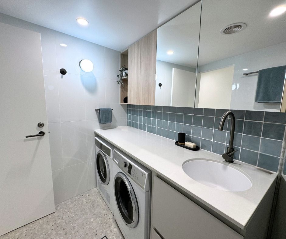 Modern Laundry Room With Washing Machine and Sink — Nyblad Construction in Caloundra West, QLD