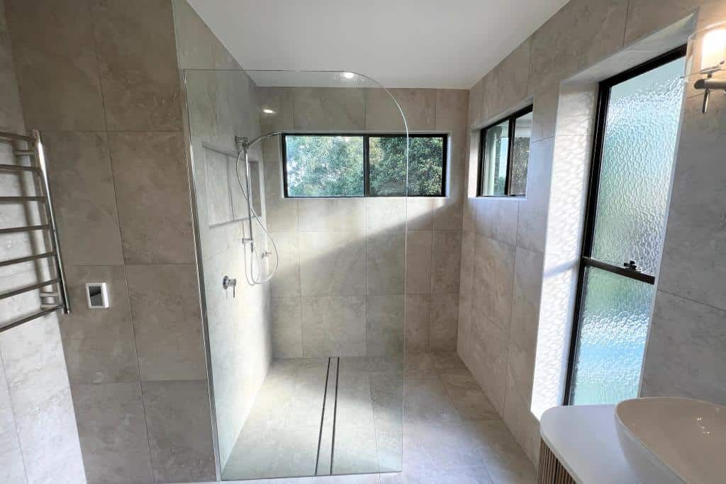 Bathroom With a Walk in Shower and a Sink — Nyblad Construction in Caloundra West, QLD
