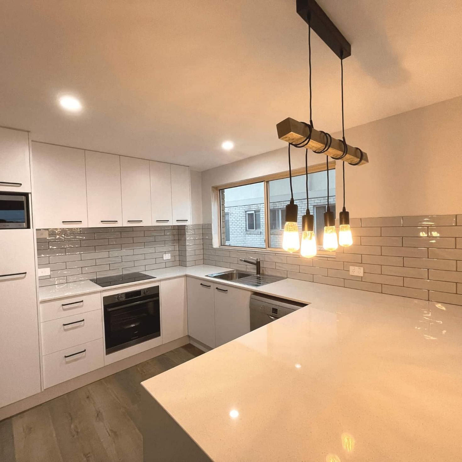 Kitchen With White Cabinets — Nyblad Construction in Caloundra West, QLD
