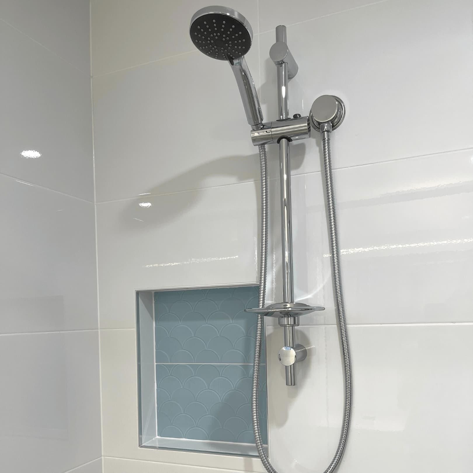 Shower Head in a Bathroom Next to a Window — Nyblad Construction in Caloundra West, QLD