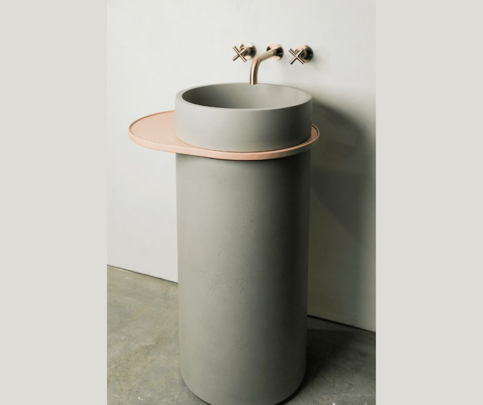 A Bathroom Sink Is Sitting On A Concrete Floor Next To A Wall — Nyblad Construction in Caloundra West, QLD