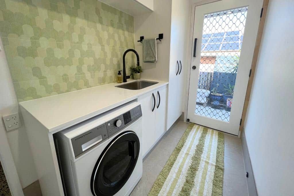 Laundry Room With a Washing Machine — Nyblad Construction in Caloundra West, QLD