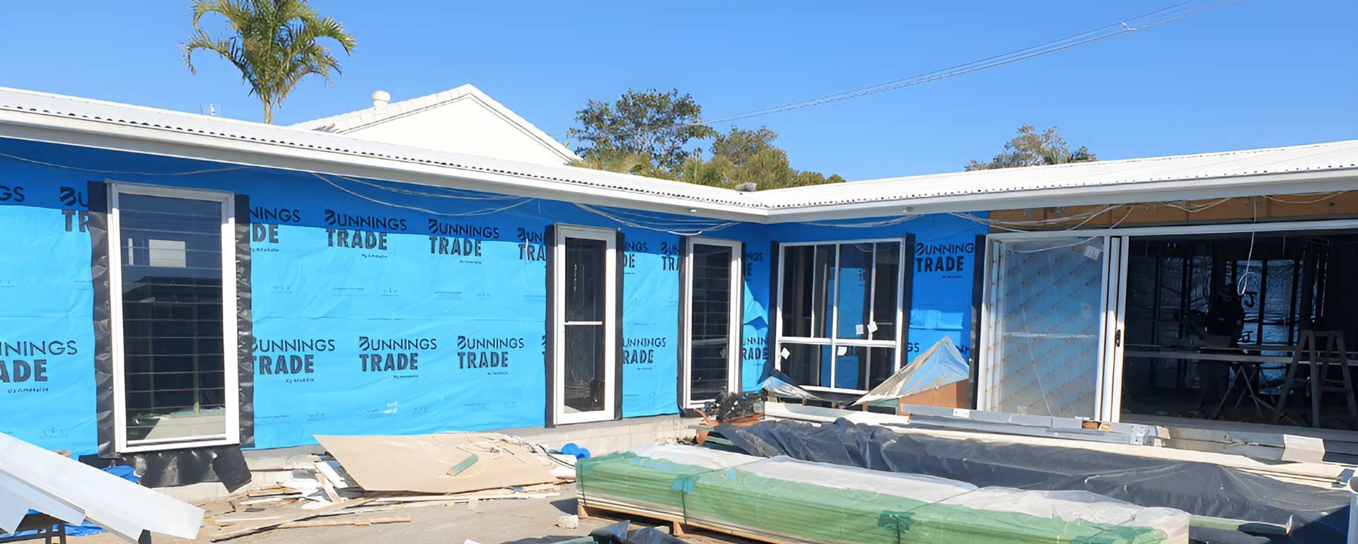 A House Is Being Built With A Lot Of Windows And Doors — Nyblad Construction in Caloundra West, QLD