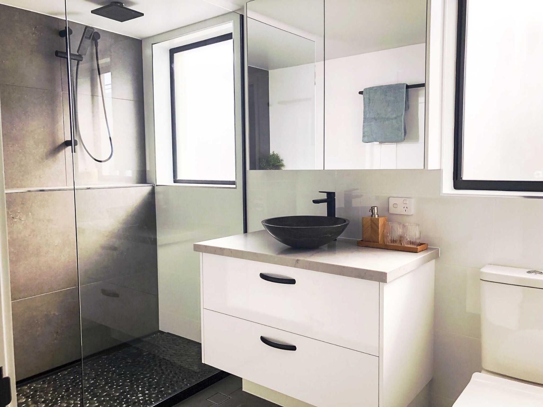 Bathroom With a Sink, Toilet and Shower — Nyblad Construction in Caloundra West, QLD