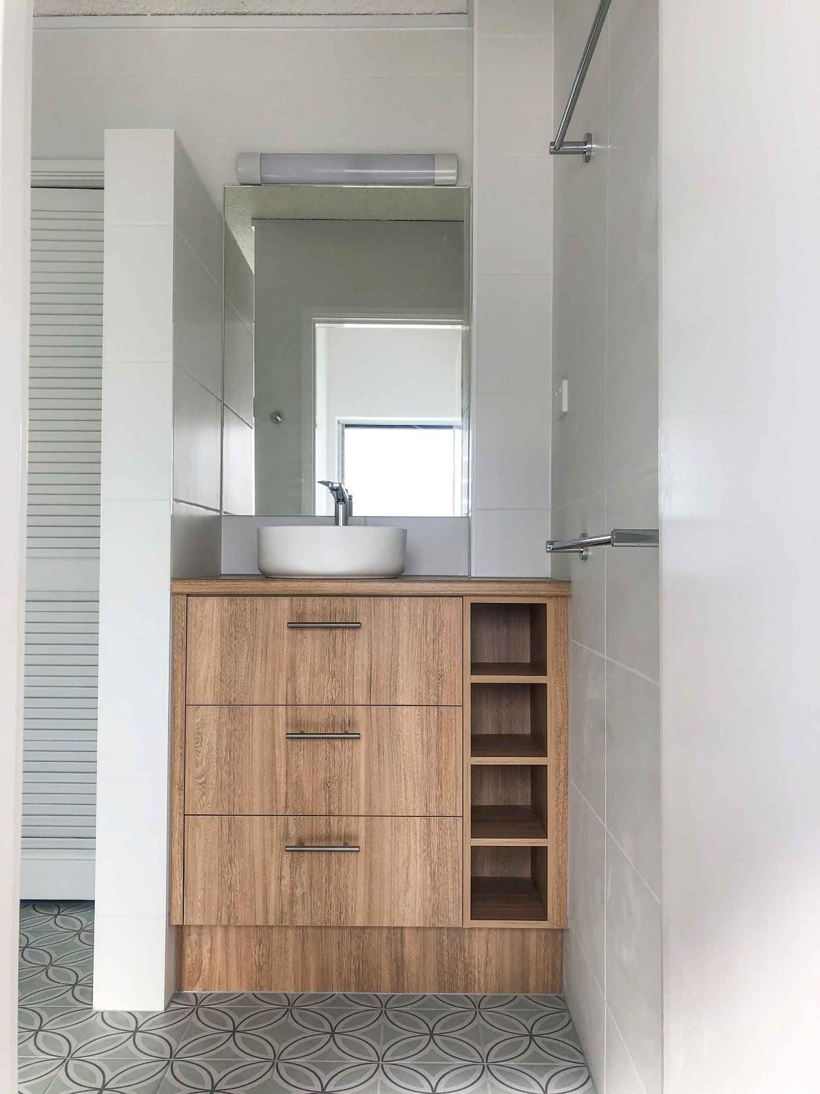 Bathroom With a Wooden Vanity — Nyblad Construction in Caloundra West, QLD