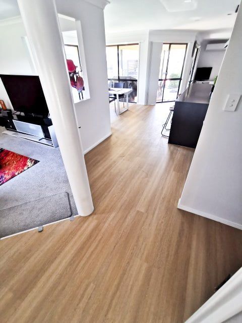 Living Room With a Wooden Floor — Nyblad Construction in Caloundra West, QLD
