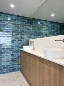 A Bathroom With Two Sinks And A Full-length Mirror — Nyblad Construction in Caloundra West, QLD