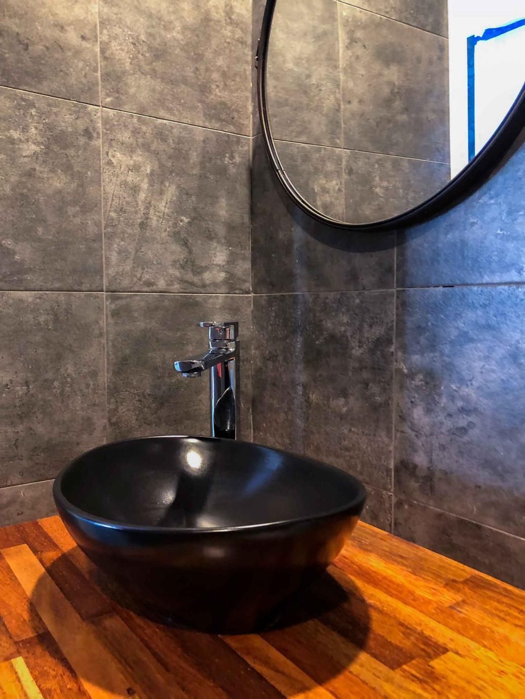 Black Sink is Sitting on a Wooden Counter — Nyblad Construction in Caloundra West, QLD