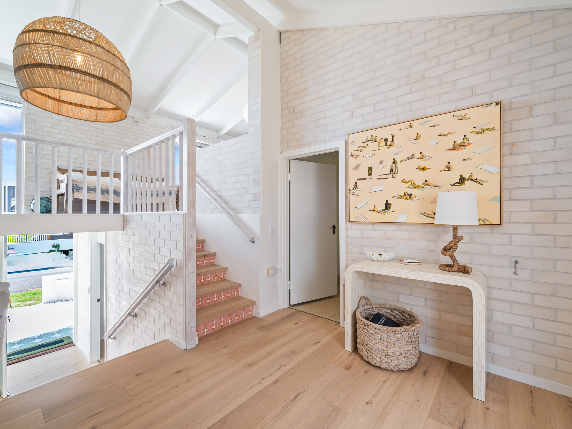 A Staircase Sits Next To A White Wall Of Bricks — Nyblad Construction in Caloundra West, QLD