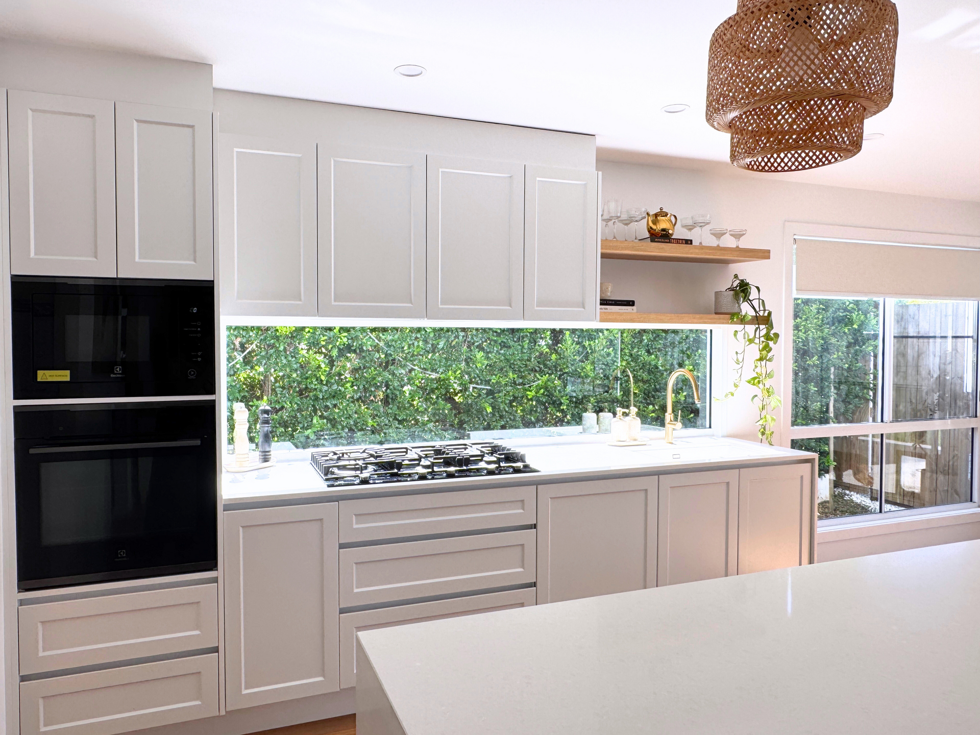 A Kitchen With White Cabinets — Nyblad Construction in Caloundra West, QLD