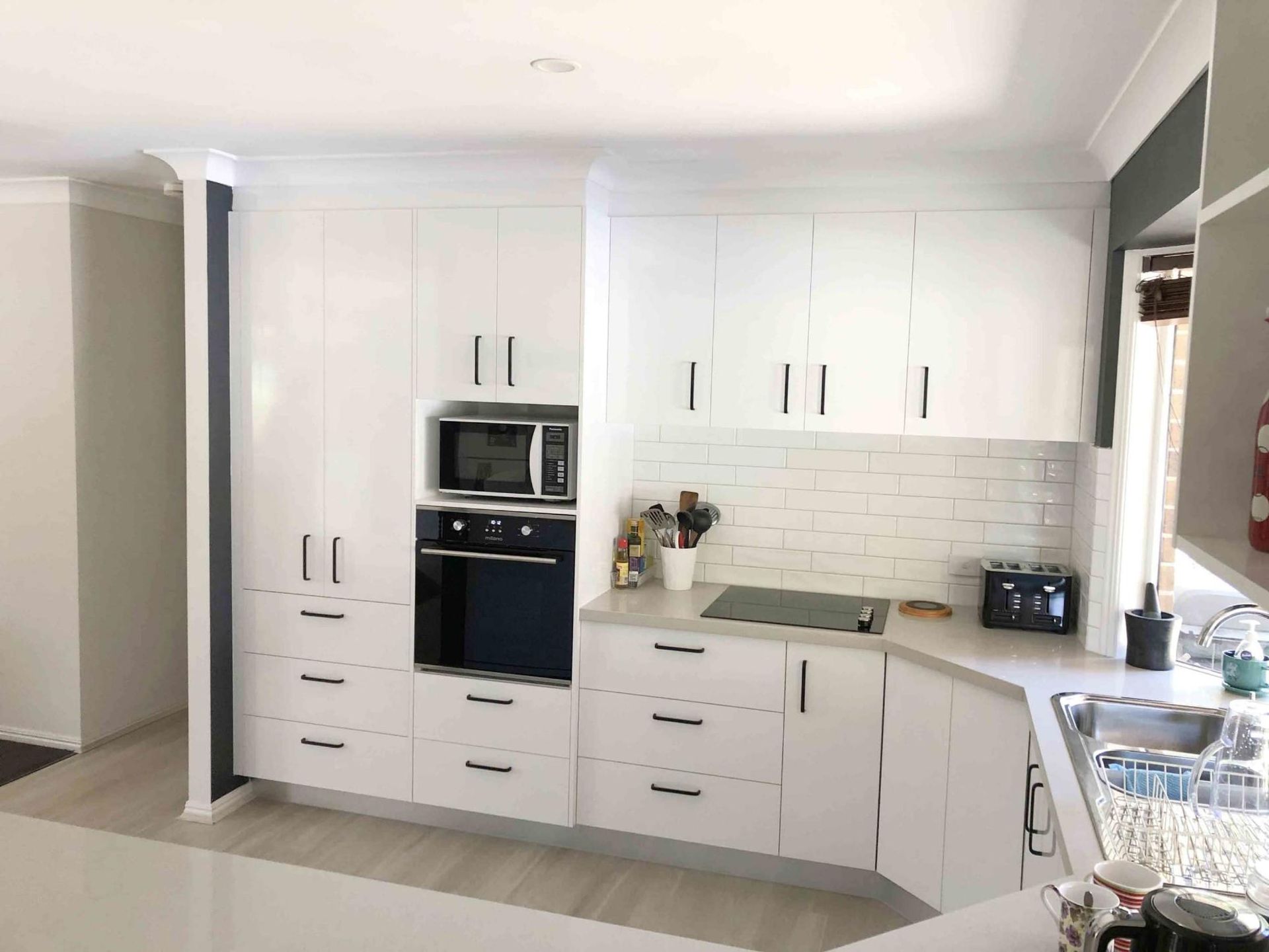 Kitchen With White Cabinets — Nyblad Construction in Caloundra West, QLD