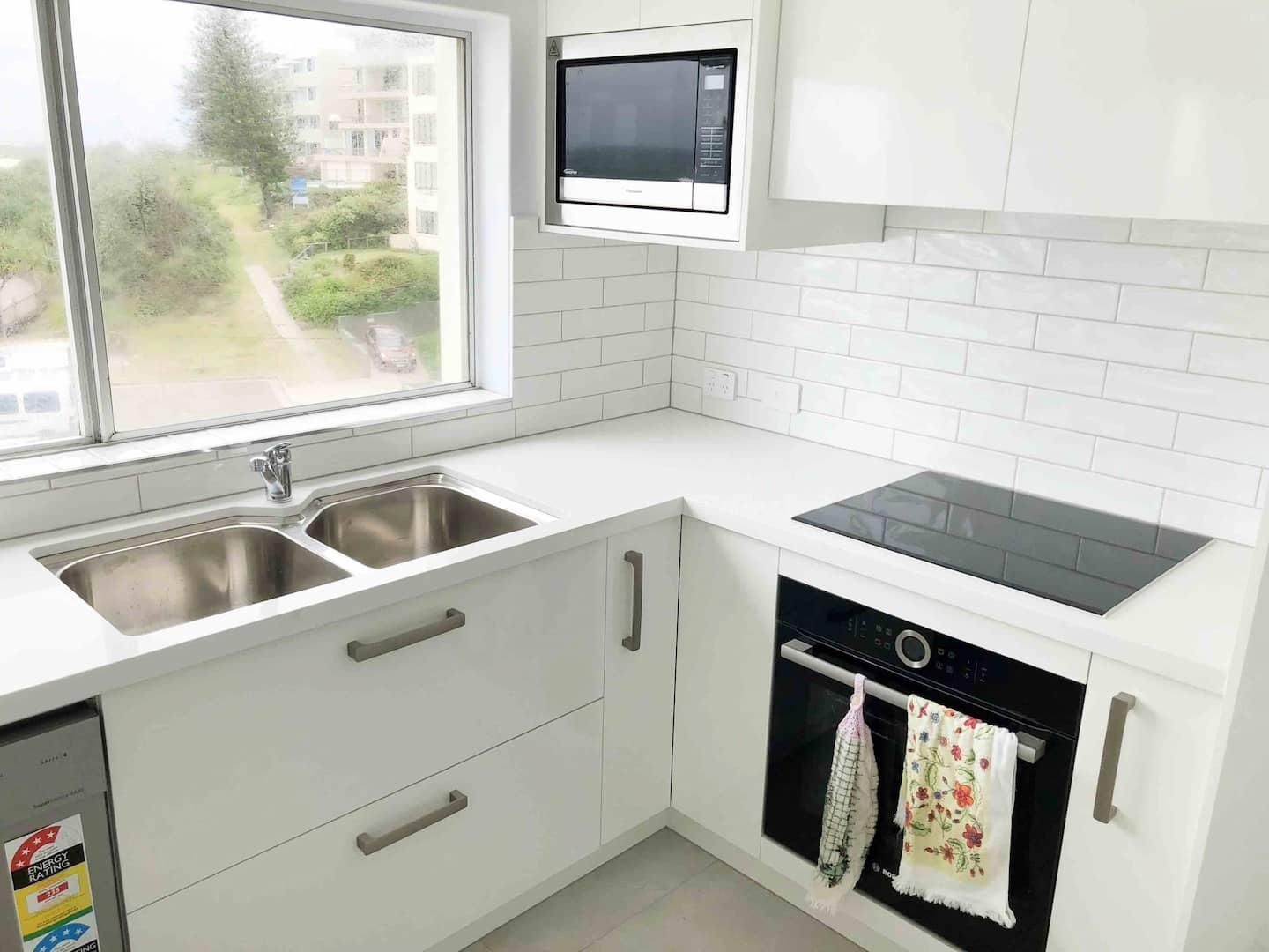 Kitchen With White Cabinets — Nyblad Construction in Caloundra West, QLD