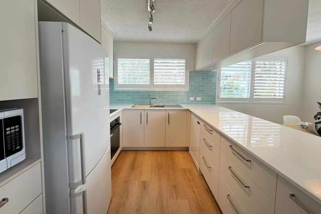Kitchen With White Cabinets — Nyblad Construction in Caloundra West, QLD