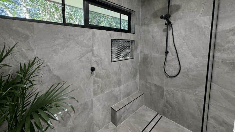 Bathroom With a Walk in Shower and a Window — Nyblad Construction in Caloundra West, QLD