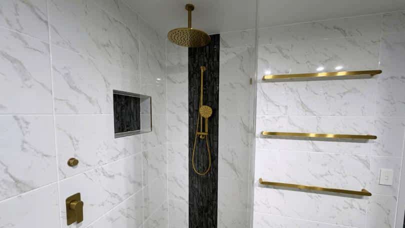 Bathroom With Marble Tiles and a Walk — Nyblad Construction in Caloundra West, QLD