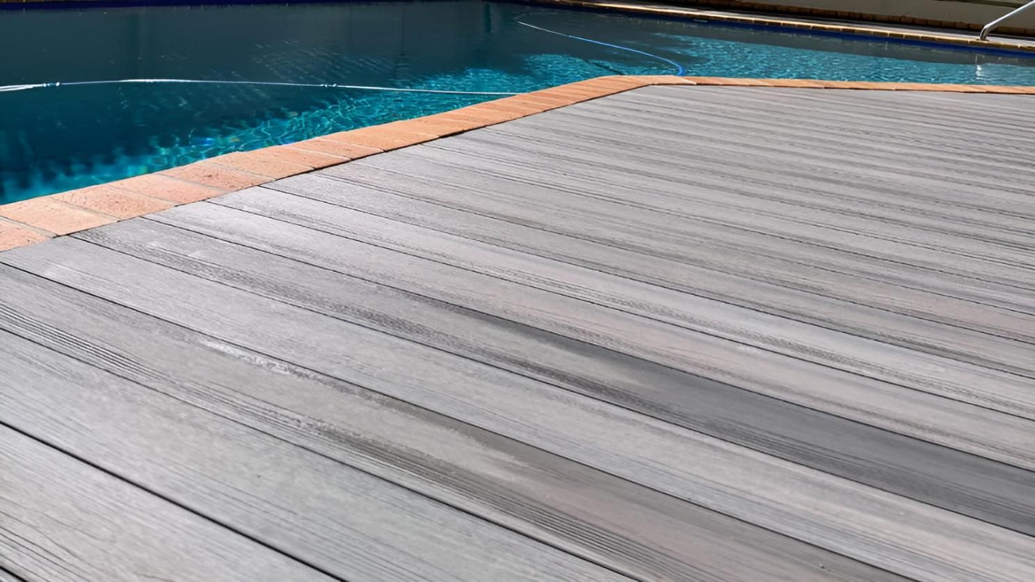 Wooden Deck Next to a Swimming Pool — Nyblad Construction in Caloundra West, QLD