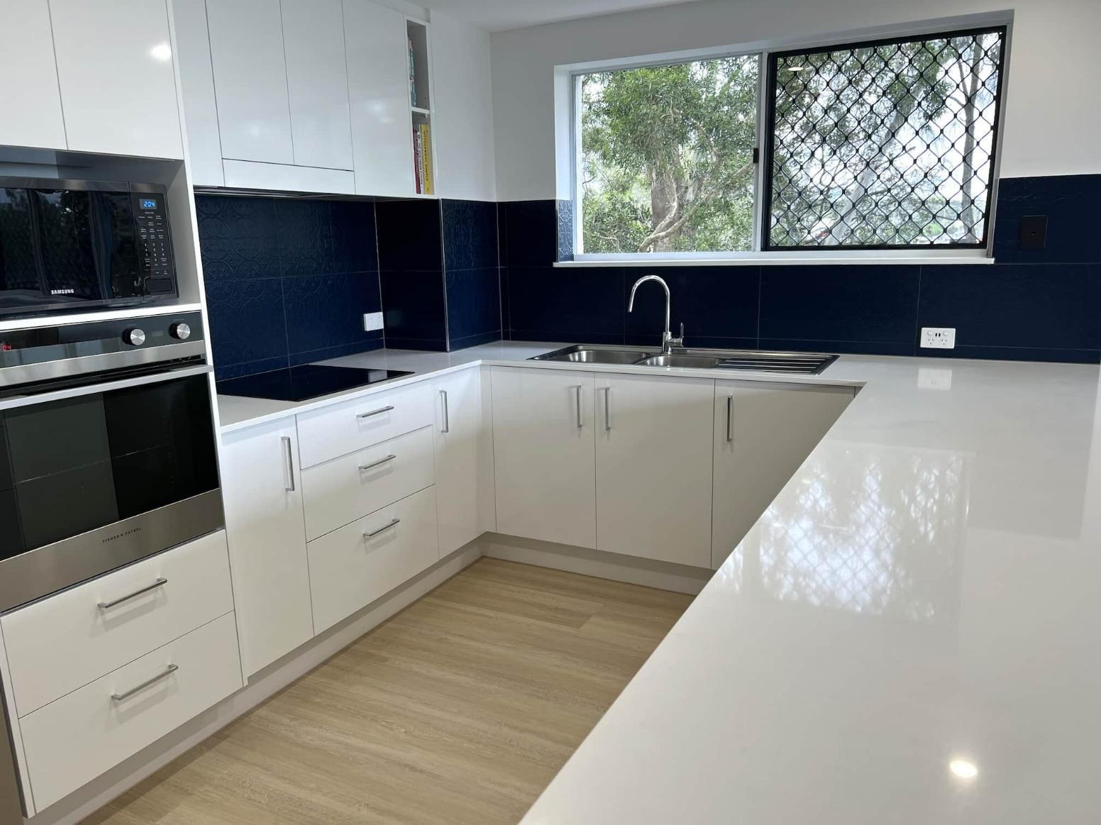 Kitchen With White Cabinets — Nyblad Construction in Caloundra West, QLD