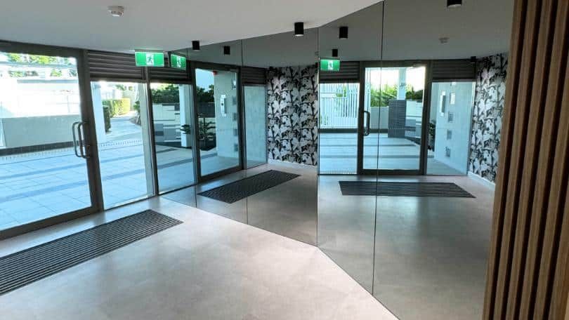 Large Empty Lobby With a Lot of Doors and Mirrors — Nyblad Construction in Caloundra West, QLD