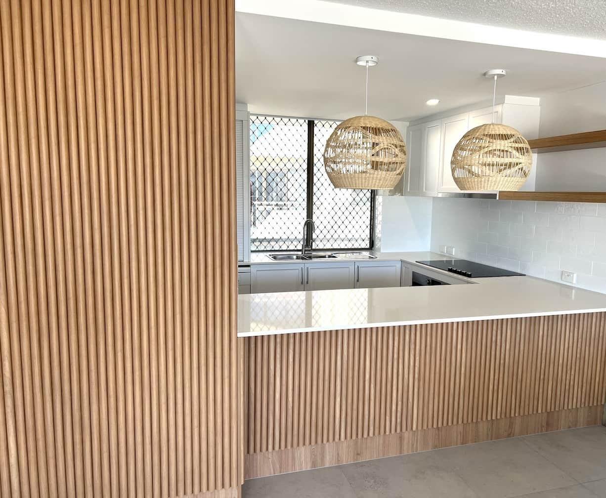 Kitchen With a Wooden Wall — Nyblad Construction in Caloundra West, QLD