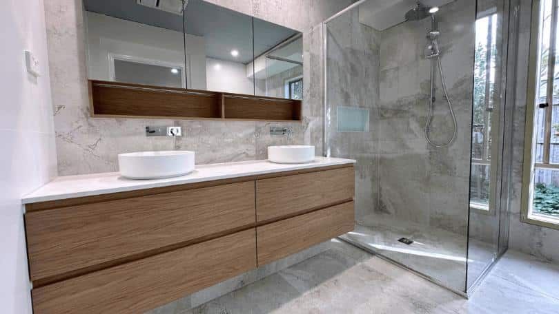 Bathroom With Two Sinks and a Walk in Shower — Nyblad Construction in Caloundra West, QLD