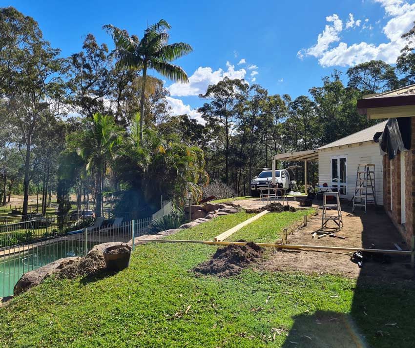 A White Truck Is Parked In Front Of A House — Nyblad Construction in Caloundra West, QLD