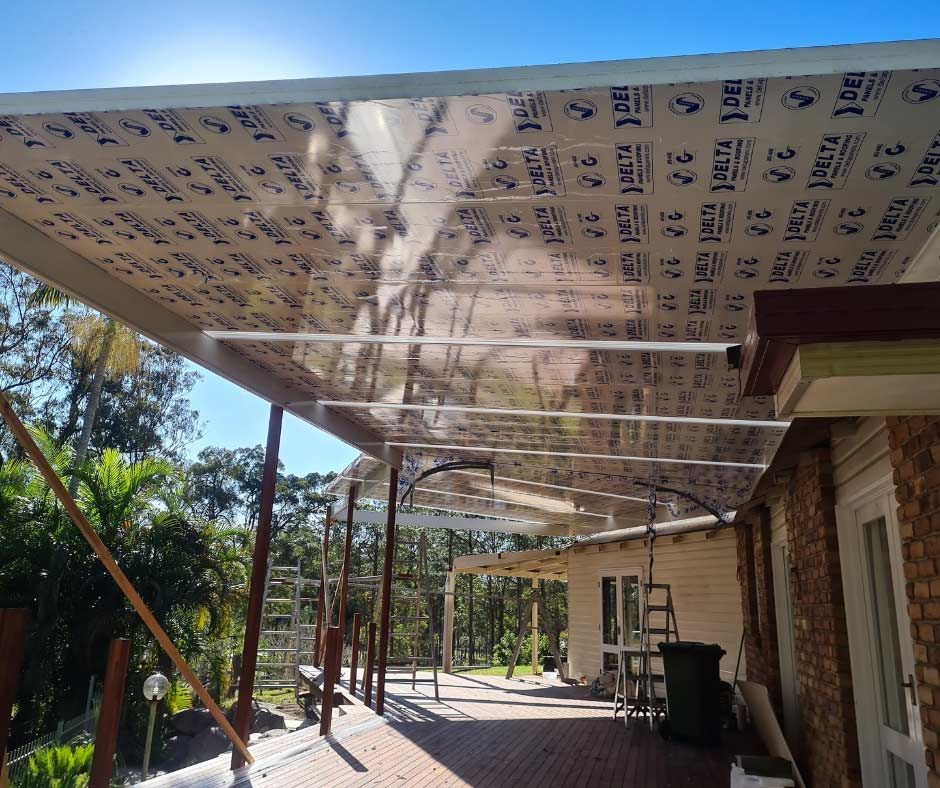 A Clear Roof Is Being Installed On The Side Of A House — Nyblad Construction in Caloundra West, QLD