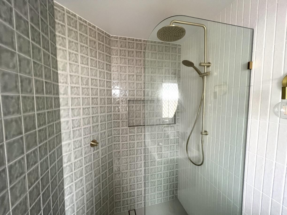 Bathroom With White Tiles — Nyblad Construction in Caloundra West, QLD