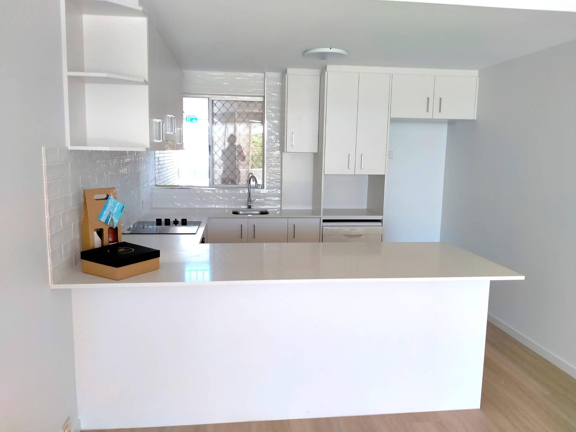 Kitchen With White Cabinets and a Counter Top — Nyblad Construction in Caloundra West, QLD