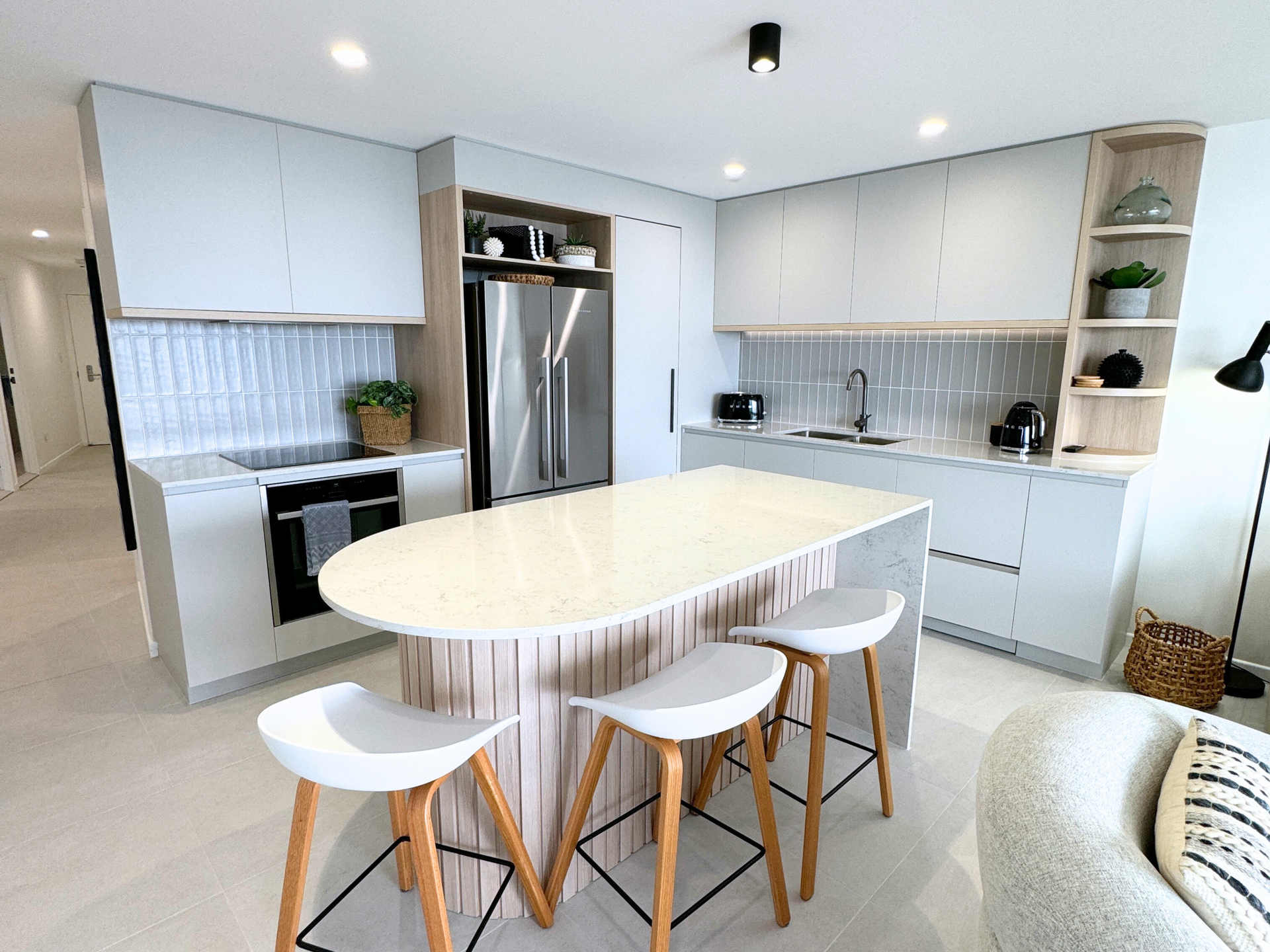 A Kitchen With White Cabinets, A Sink, And A Benchtop — Nyblad Construction in Caloundra West, QLD
