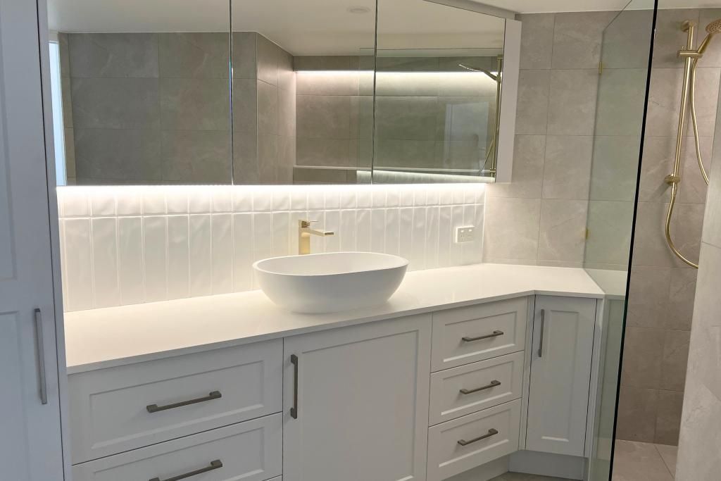 Bathroom With White Cabinets — Nyblad Construction in Caloundra West, QLD