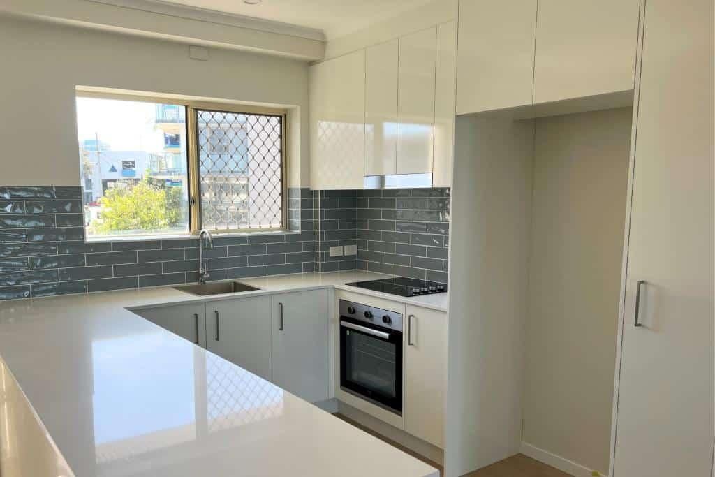 Kitchen With White Cabinets — Nyblad Construction in Caloundra West, QLD