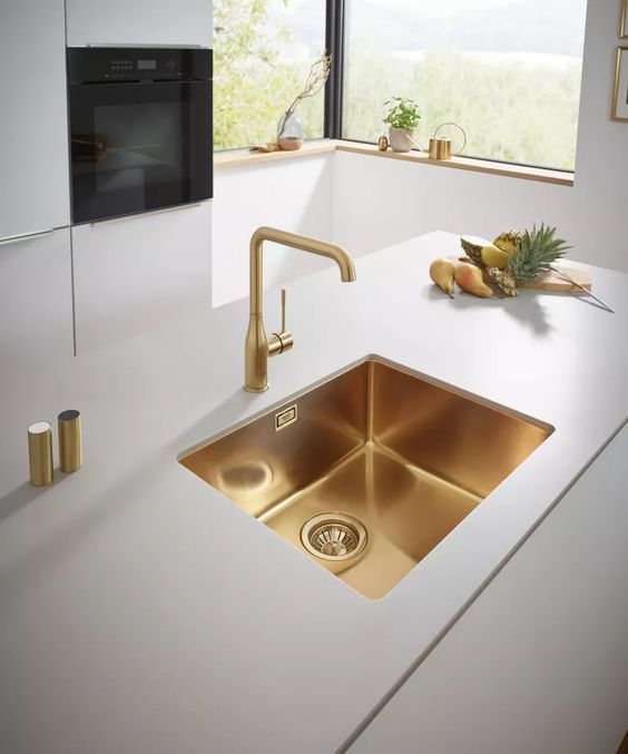 A Kitchen Counter With A Golden Sink And A Faucet — Nyblad Construction in Caloundra West, QLD