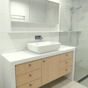 Beech Veneer Cabinets And White Bench Tops — Nyblad Construction in Caloundra West, QLD