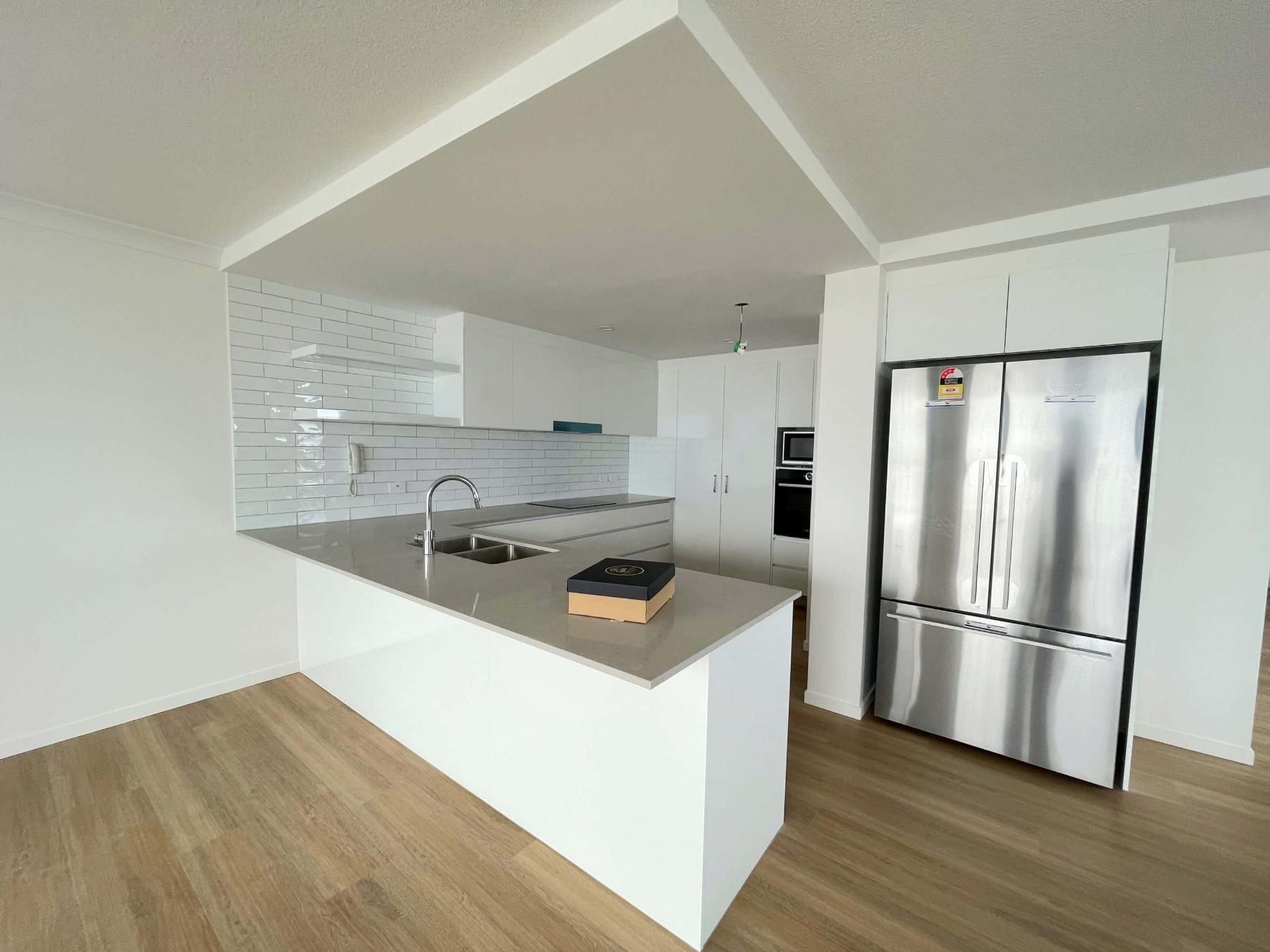 Kitchen With White Cabinets — Nyblad Construction in Caloundra West, QLD