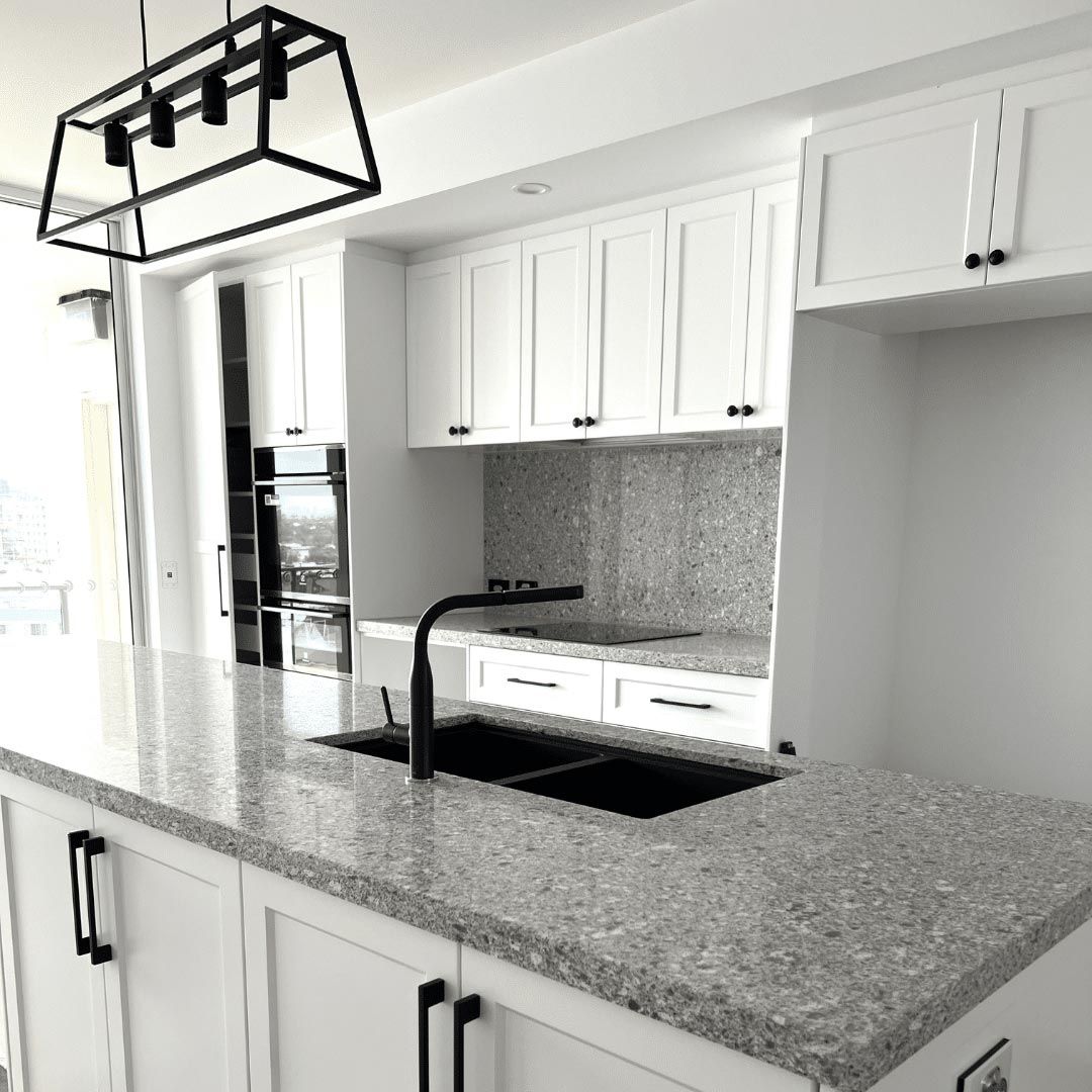 A Kitchen With Granite Counter Tops — Nyblad Construction in Caloundra West, QLD