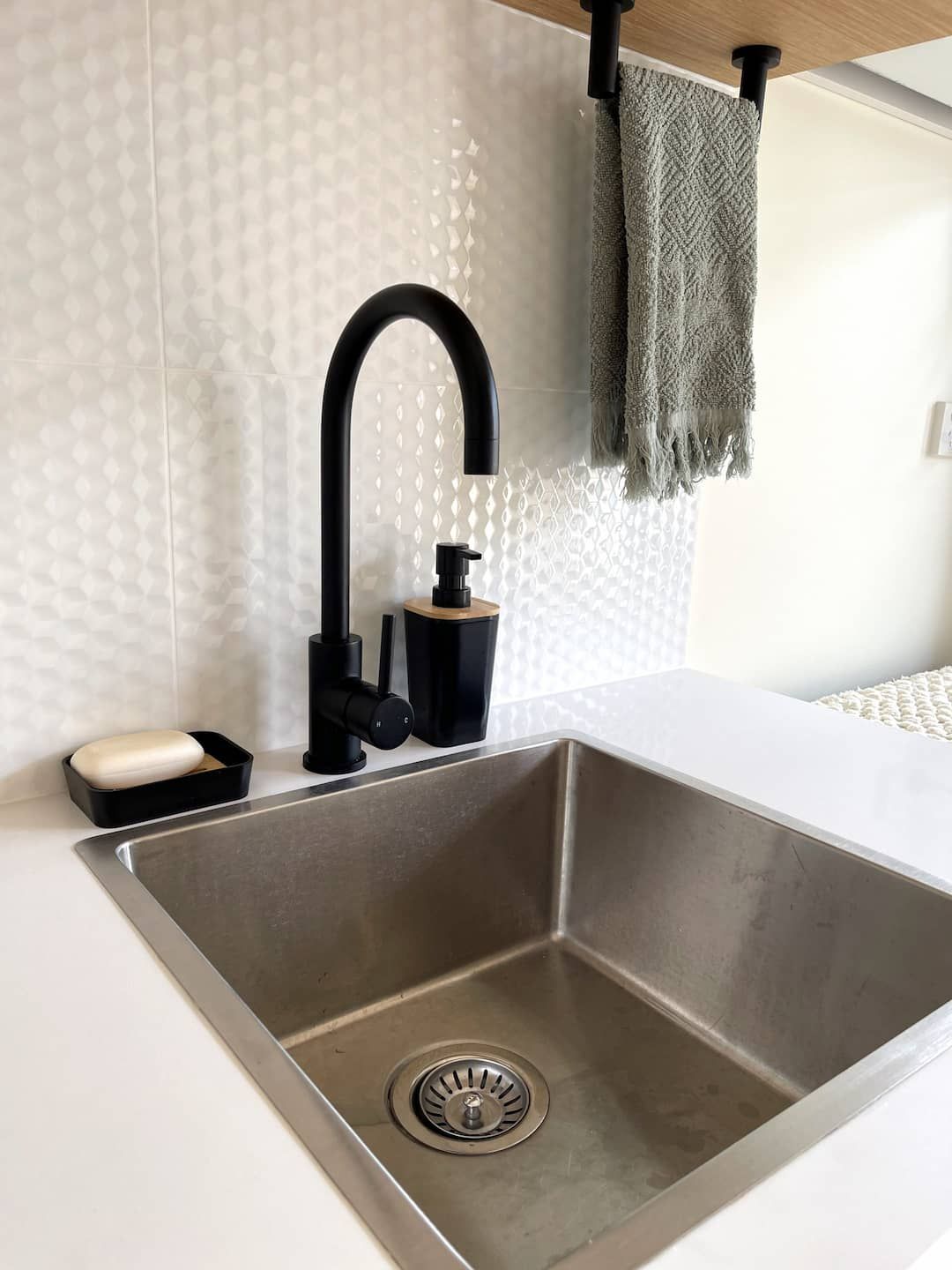 Kitchen Sink With a Black Faucet — Nyblad Construction in Caloundra West, QLD