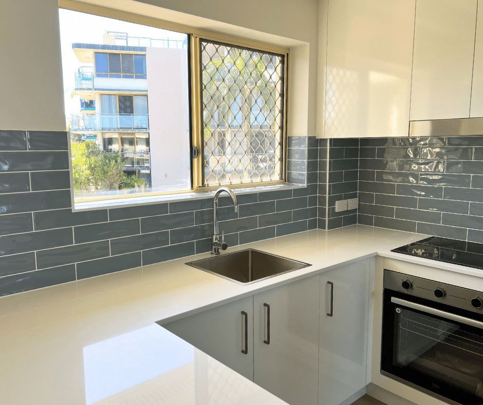 Kitchen Modern Design With White Cabinets — Nyblad Construction in Caloundra West, QLD